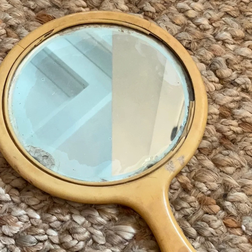 Antique handheld vanity mirror
